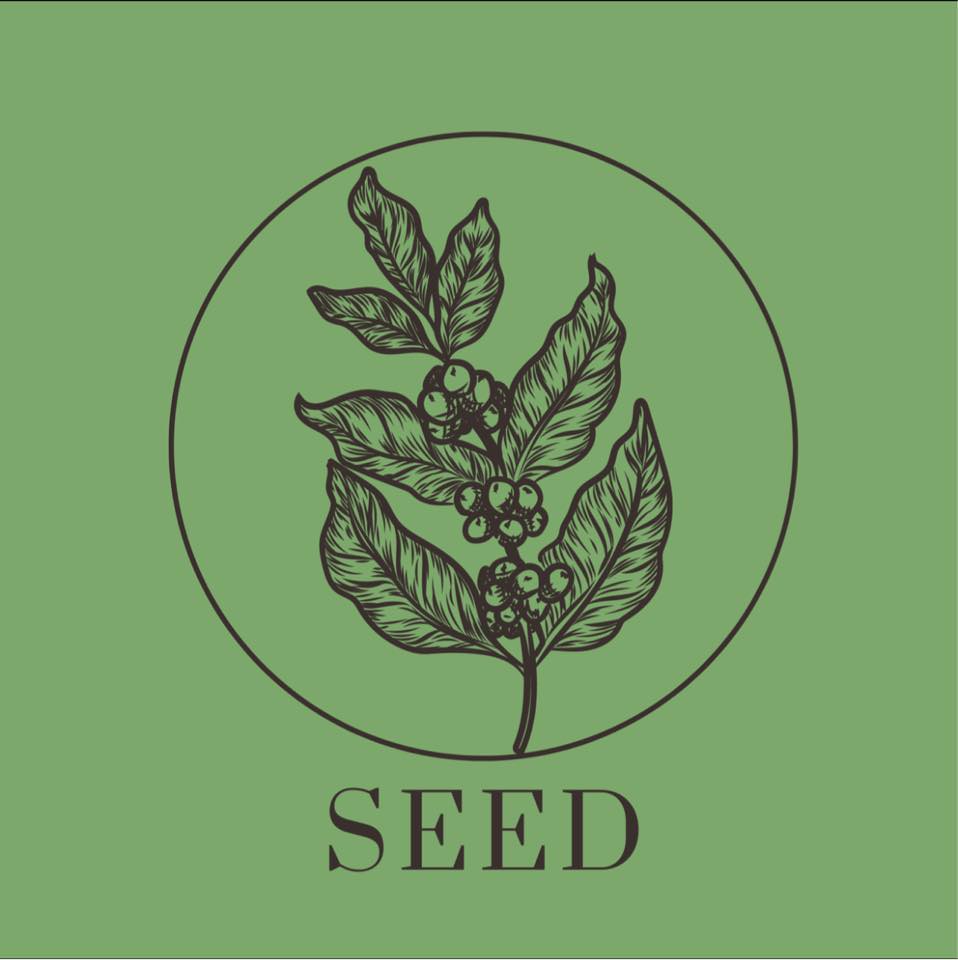 Seed Cafe's logo. line drawing of a plant in a circle with the word "SEED" underneath