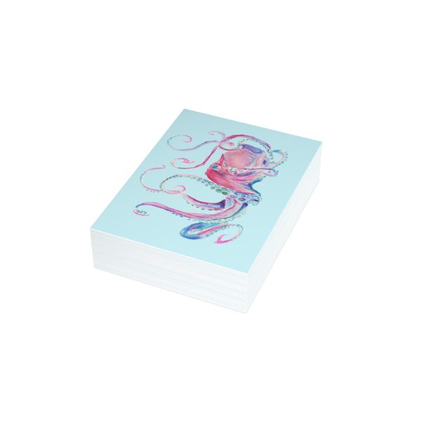 Stack of cards with octopus drawing.