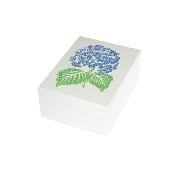 Stack of cards with blue flower print